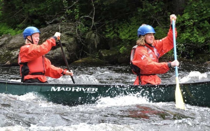 teens whitewater canoeing